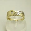 Bicolor gouden ring met briljant 0.10 ct.