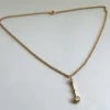 Gouden collier met gouden hanger en briljant