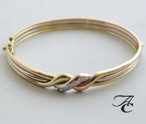 Gouden tricolor armband met diamant