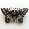 Antieke vlinder broche met roosdiamant, robijn en smaragd