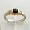 Bicolor gouden ring met diamant en saffier