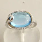 Gouden ring met topaas en diamant