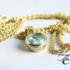 Gouden hanger met topaas