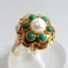 Gouden ring met eilat en parel