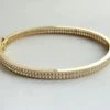 Geel gouden slavenarmband met zirkonia Christian