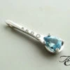 Wit gouden hanger met diamant en topaas