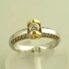 Bicolor Christian gouden ring met briljant