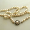 Parelcollier met gouden saffieren slot