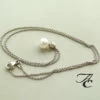 Wit gouden collier en hanger met parel en diamant