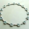 18 karaat wit gouden topaas en diamanten collier