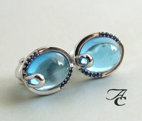 Wit gouden oorbellen met topaas en diamant