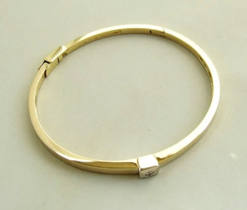 Gouden slavenarmband met briljant