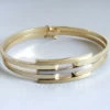 14 karaat gouden bicolor slavenarmband
