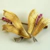 Gouden broche met diamanten en robijnen