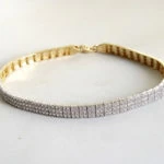 14 karaat geel- en wit gouden armband met zirkonia