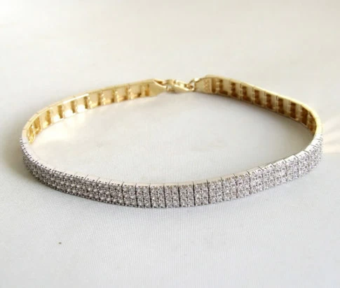 14 karaat geel- en wit gouden armband met zirkonia