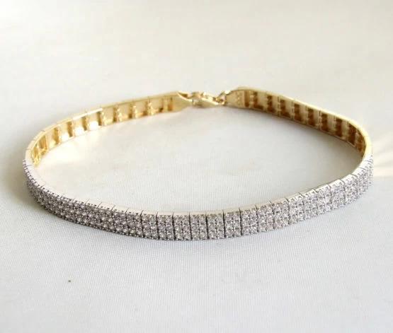 14 karaat geel- en wit gouden armband met zirkonia