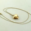 Geel gouden collier met harten hanger