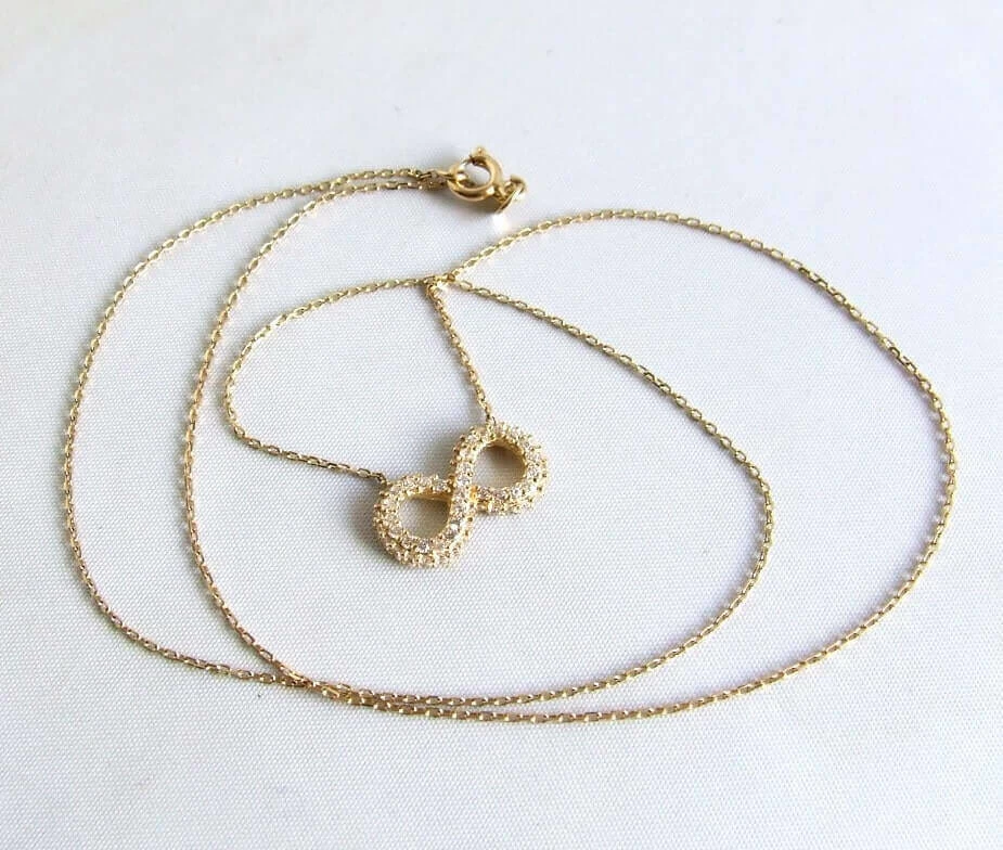 Gouden Infinity collier met zirkonia
