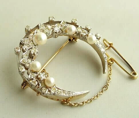 Bicolor broche met parels en diamanten Bicolor broche met parels en diamanten
