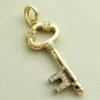 Gouden diamanten hanger sleutel