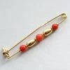 18 karaat broche met bloedkoraal