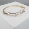 Bicolor slavenarmband met balletjes