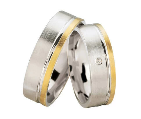 Bicolor trouwringen met 1 diamant