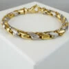 Christian armband bicolor goud