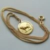 Gouden collier met stier hanger