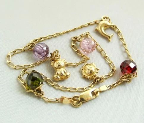 Gouden enkelband met bedels
