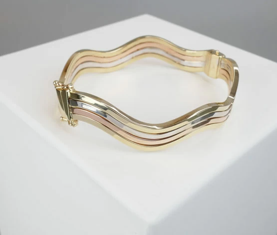 Gouden tricolor slavenarmband golvend model