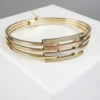 Gouden tricolor slavenarmband met zirkonia