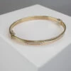 Gouden tricolor slavenarmband vlak model