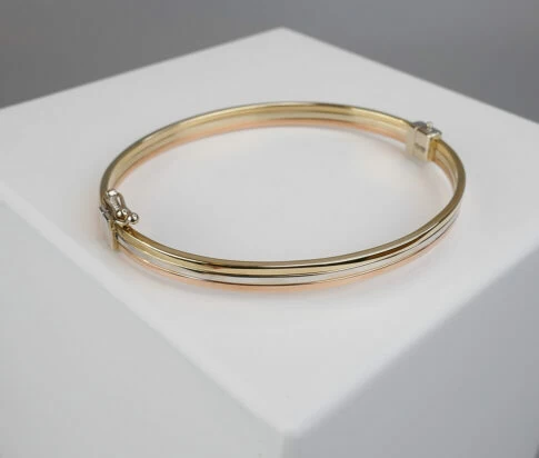 Gouden tricolor slavenarmband vlak model