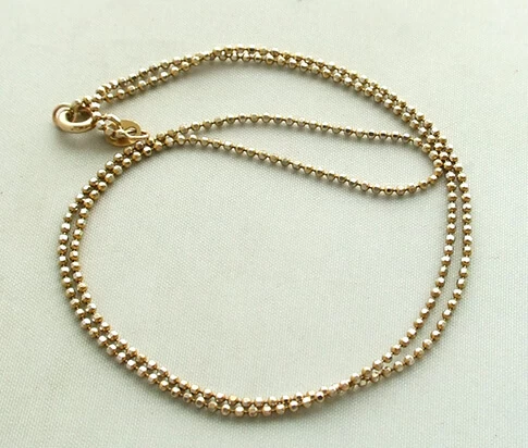 Gouden balletjes collier