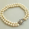 Parel armband met saffier en diamanten slot