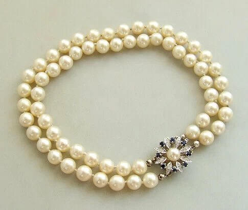 Parel armband met saffier en diamanten slot