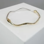 14 karaat gouden bicolor slavenarmband Christian