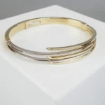 Bicolor gouden Christian slavenarmband Bicolor gouden Christian slavenarmband