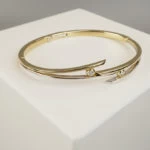 Bicolor gouden Christian slavenarmband