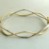Christian bicolor gouden slavenarmband