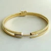 Christian gouden slavenarmband