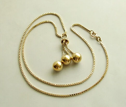Geel gouden collier met balletjes