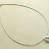 Wit gouden collier met topaas