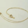 Gouden ketting en zirkonia harten sleutelhanger