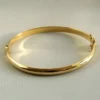 Christian 14 karaat gouden slavenarmband