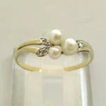 Geel gouden ring met parel en diamant