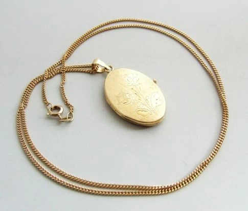 Geel gouden medaillon met bloem motief