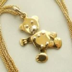 Gouden collier met teddybeer hanger